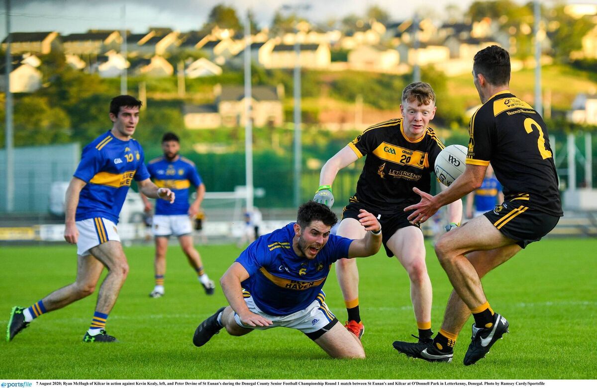 BATTLE: Ryan McHugh of Kilcar in action against Kevin Kealy, left, and Peter Devine of St Eunan's. Pic: Ramsey Cardy/Sportsfile BATTLE: Ryan McHugh of Kilcar in action against Kevin Kealy, left, and Peter Devine of St Eunan's. Pic: Ramsey Cardy/Sportsfile