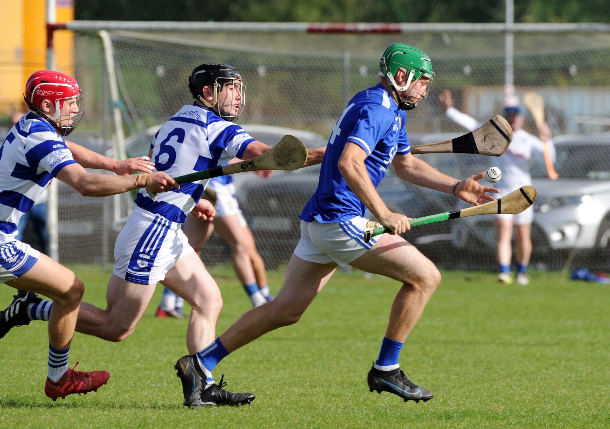 DETERMINATION: Ballinhassig's Conor Desmond being chased by Inniscarra players Liam Ryan and Jack Harrington in the Co-op Superstores Cork PIHC at Cloughduv. Pic: Denis Minihane.