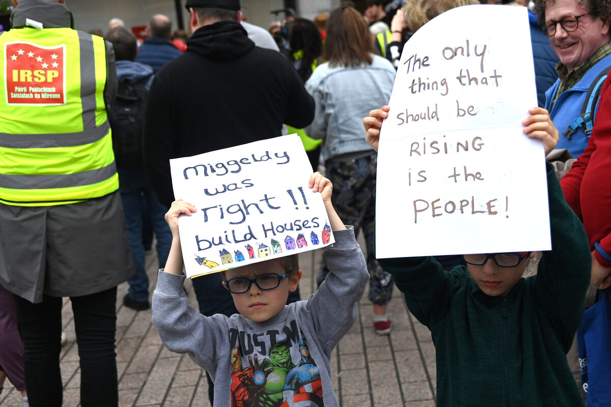 Young brothers, Max and Oscar Grahame, each with a message for our politicians, at the protest march on St Patrick's Street, Cork City, on Saturday. Picture: Larry Cummins Young brothers, Max and Oscar Grahame, each with a message for our politicians, at the protest march on St Patrick's Street, Cork City, on Saturday. Picture: Larry Cummins