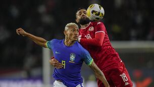 <p>UGLY INCIDENT: Tunisia's Ghaylen Chaaleli, right, duels for the ball with Brazil's Richarlison during the international friendly soccer match between Brazil and Tunisia at the Parc des Princes stadium in Paris, France, Tuesday, Sept. 27, 2022. (AP Photo/Christophe Ena)</p>
