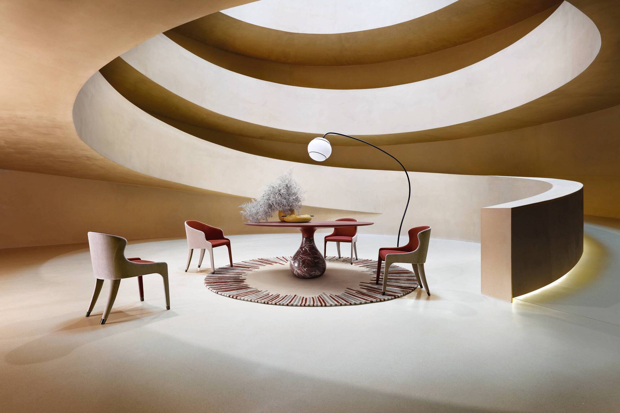 The Aqua dining table, Steeple chair and Omino lamp from Roche Bobois.