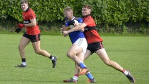 <p>BREAKING TACKLES: Killian O'Hanlon for Kilshannig getting tackled by Michelstowns Mark Keane. Pic: Denis Boyle</p>
