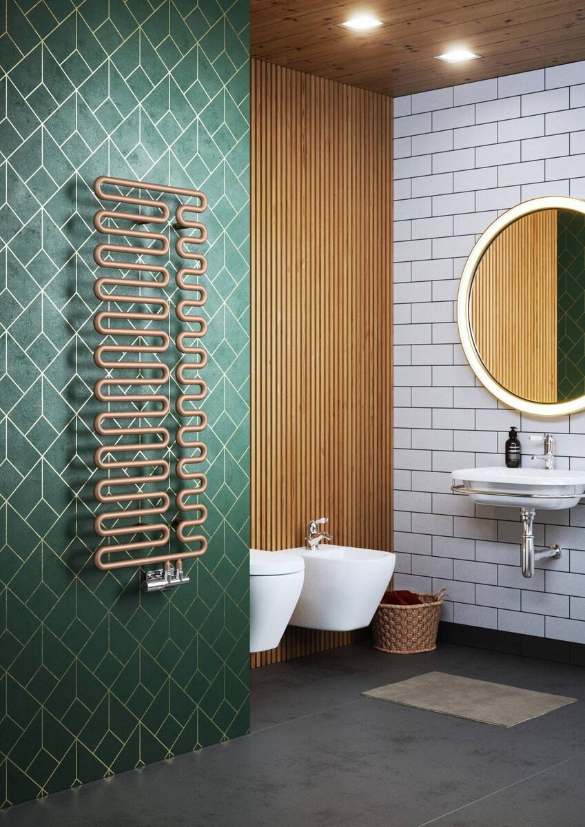 This Terma Swale towel rail in gentled industrial style uses a pipe-bending technique, and can carry clothes and towels in dozens of positions. The rail features two very large, chunky round bars formed into a snake-like shape laid over the top of each other. It’s easily attached to a standard 50mm H-block valve. Rubbed metals are ideal against the AW22 trend for highly glazed tiling. It’s priced at €409.99 in copper, black or white, wayfair.ie.