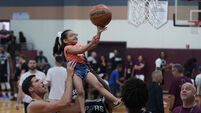 Basketball stars lift children in visit to Texas mass shooting town
