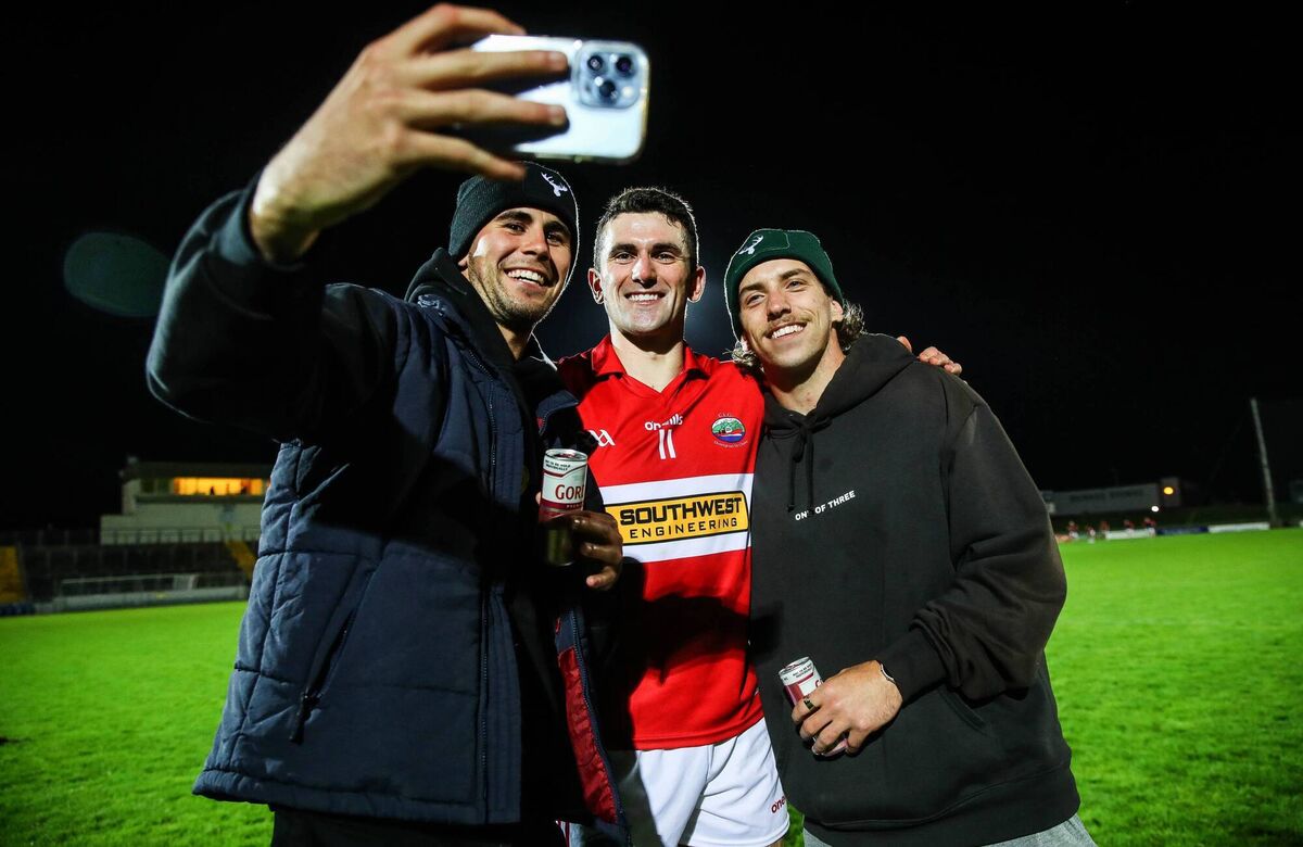 STAR TURN: Dingle's Mark O’Connor poses for a photo with his Geelong Premiership winner teammates Nick Stevens and Francis Evans.