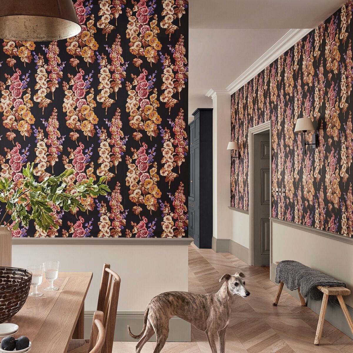 Dark but far from dreary, wallpaper with a deep ground colour can be balanced against white or neutral walls. Hollyhocks from Sandersons in Copper/Rhodera. €142 per roll, wallpaperdirect.com