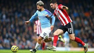 <p>LOCAL BOY MADE GOOD: John Egan does battle with Sergio Aguero of Manchester City during the Premier League match between the sides in 2019. Pic: Alex Livesey/Getty Images</p>