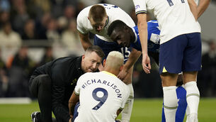 <p>Tottenham Hotspur's Richarlison is treated for an injury before being forced to leave the pitch during the Premier League match at Tottenham Hotspur Stadium, London. Picture date: Saturday October 15, 2022.</p>