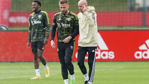 <p>Manchester United’s Luke Shaw talks with manager Erik ten Hag during a training session (PA). </p>