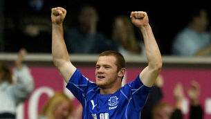 Wayne Rooney celebrates his famous winner against Arsenal (PA Archive)