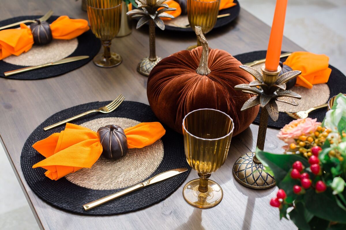  The typical orange and black Halloween colourway goes ultra stylish with The Designed Table's addition of pumpkin napkin rings (four for €28) and the natural grass and black place mat (€10).