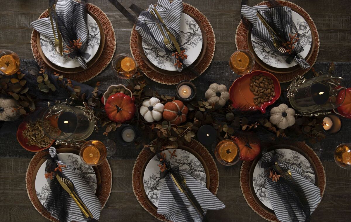  Black striped napkins can be themed with a black ribbon and orange detailing for a stylish, tacky-free Halloween tablescape (set of six napkins €39 at Meadows &amp; Byrne).