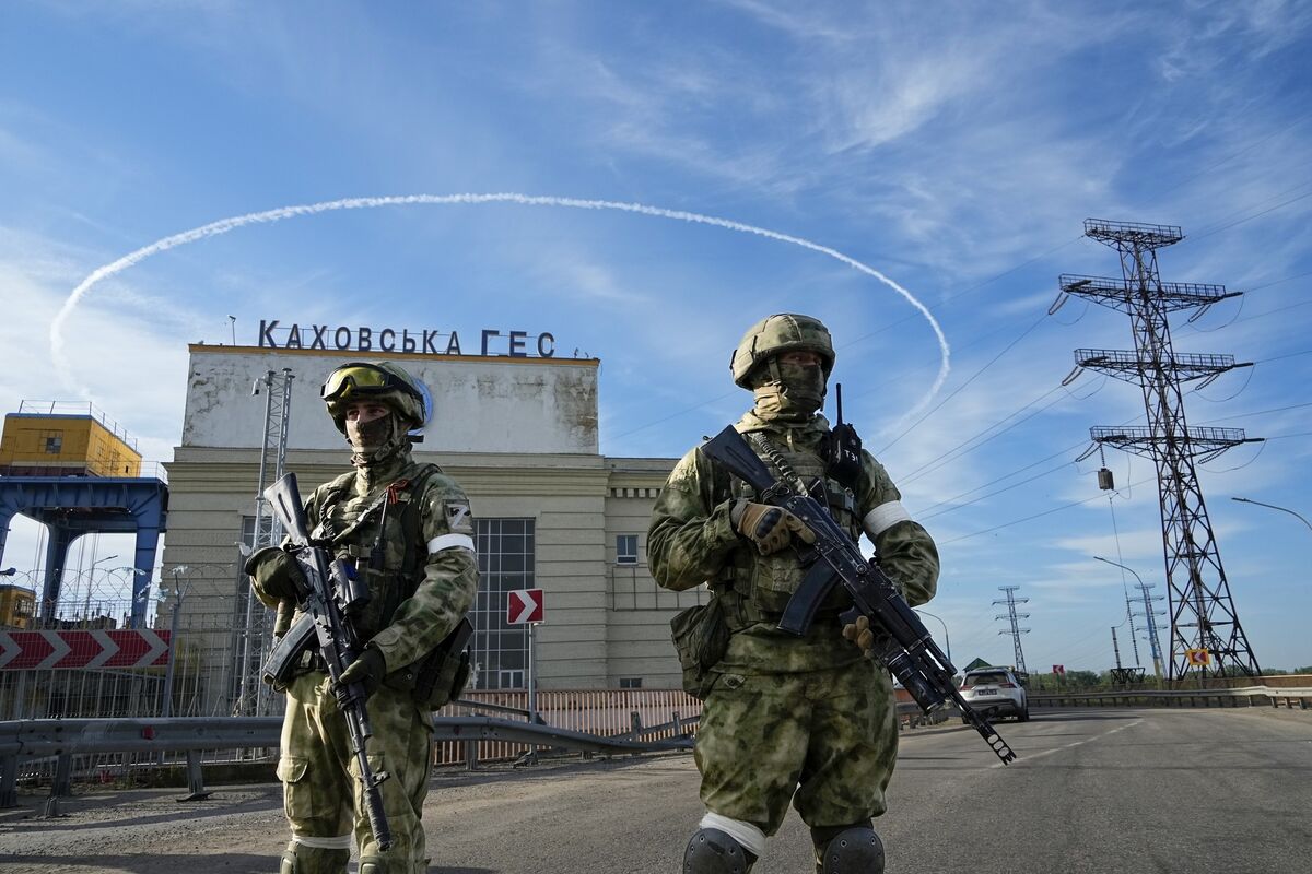 Russian troops guard an entrance of the Kakhovka Hydroelectric Station, a run-of-the-river power plant on the Dnieper River in Kherson region, southern Ukraine. Picture: AP Photo