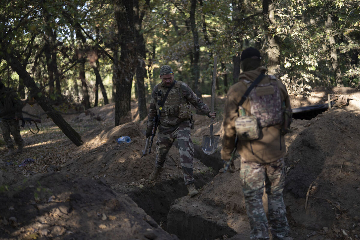 Ukrainian servicemen check the trenches dug by Russian soldiers in a retaken area in Kherson region, Ukraine, Wednesday, Oct. 12, 2022. Picture: AP Photo/Leo Correa