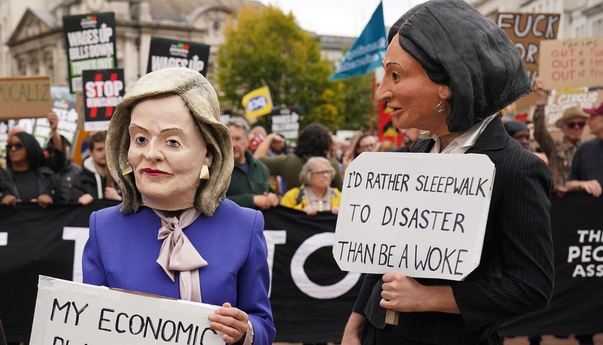Protesters wearing papier mache heads of (left to right) Liz Truss and Suella Braverman, at a rally in Victoria Square, outside the Conservative Party annual conference at the International Convention Centre in Birmingham. Picture: Jacob King/PA Wire