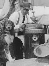 Ernest Shackleton, ‘the Boss’, at the binnacle on the bridge deck. Ernest Shackleton, ‘the Boss’, at the binnacle on the bridge deck.