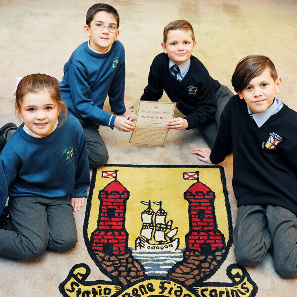 David Mahon’s great-grandchildren (from left) Leah and Daniel Brennan, Glounthaune NS, and Aaron and Dylan Minihane, Beaumont BNS who are continuing the family tradition of regular school attendance. Picture: Denis Minihane