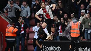 <p>JUMPING FOR JOY: Southampton's Scottish midfielder Stuart Armstrong celebrates after scoring the equalising goal during the English Premier League football match between Southampton and Arsenal at St Mary's Stadium in Southampton. Pic: Ben Stansall/AFP via Getty Images)</p>