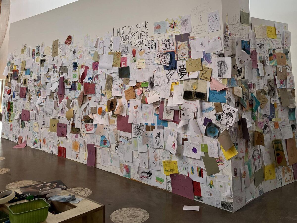 The walls of the Meat and Potatoes project space are often covered with drawings from the children who visit.