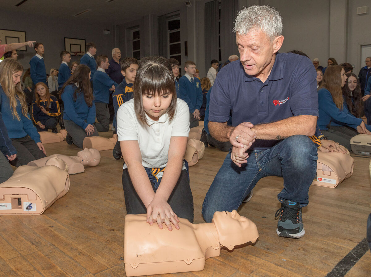 Cork City first responder Martin Crowley instructs first-year student Anna Daushanr in performing compressions on a doll as part of the CPR training day. Picture: David Creedon Cork City first responder Martin Crowley instructs first-year student Anna Daushanr in performing compressions on a doll as part of the CPR training day. Picture: David Creedon