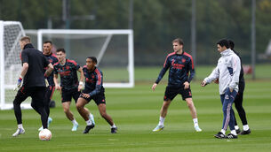<p>CLOSE EYE: Arsenal manager Mikel Arteta (right) during a training session at the Arsenal Training Centre, London Colney. Pic: Steven Paston/PA Wire.</p>