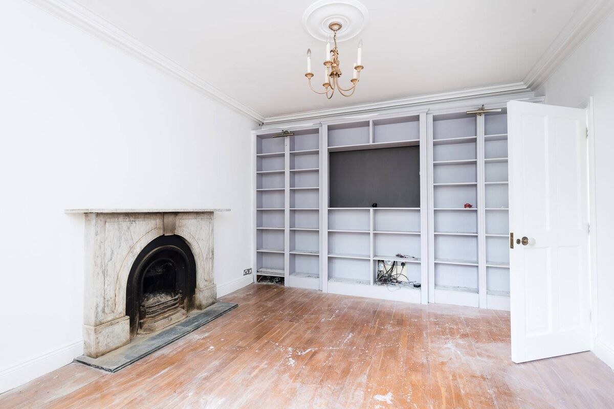 Built in bookcases and marble fireplace