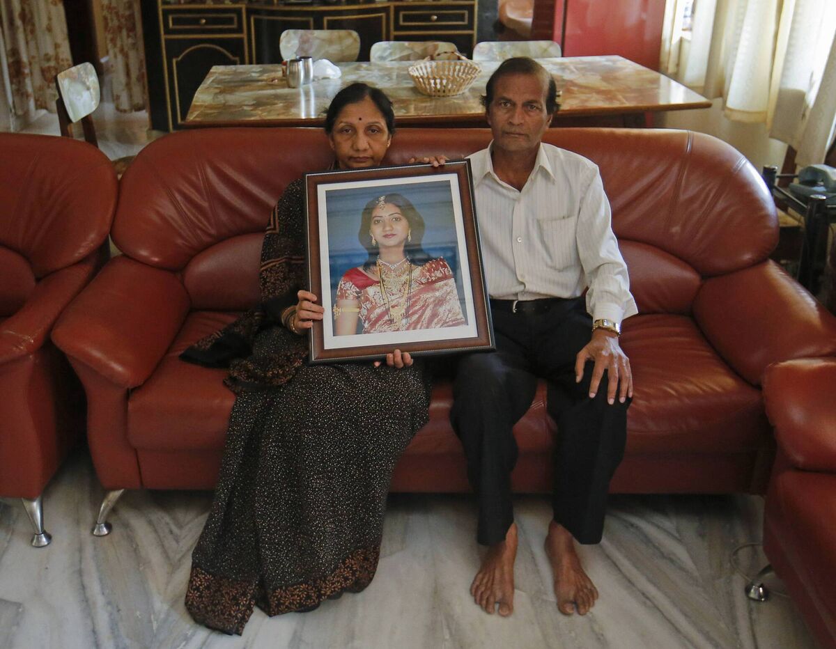 Mahadevi and Andanappa Yalagi, parents of Savita Halappanavar, hold her portrait as they pose for a picture at their house in Belgaum in the southern Indian state of Karnataka November 16, 2012. Picture: Reuters/Danish Siddiqui Mahadevi and Andanappa Yalagi, parents of Savita Halappanavar, hold her portrait as they pose for a picture at their house in Belgaum in the southern Indian state of Karnataka November 16, 2012. Picture: Reuters/Danish Siddiqui