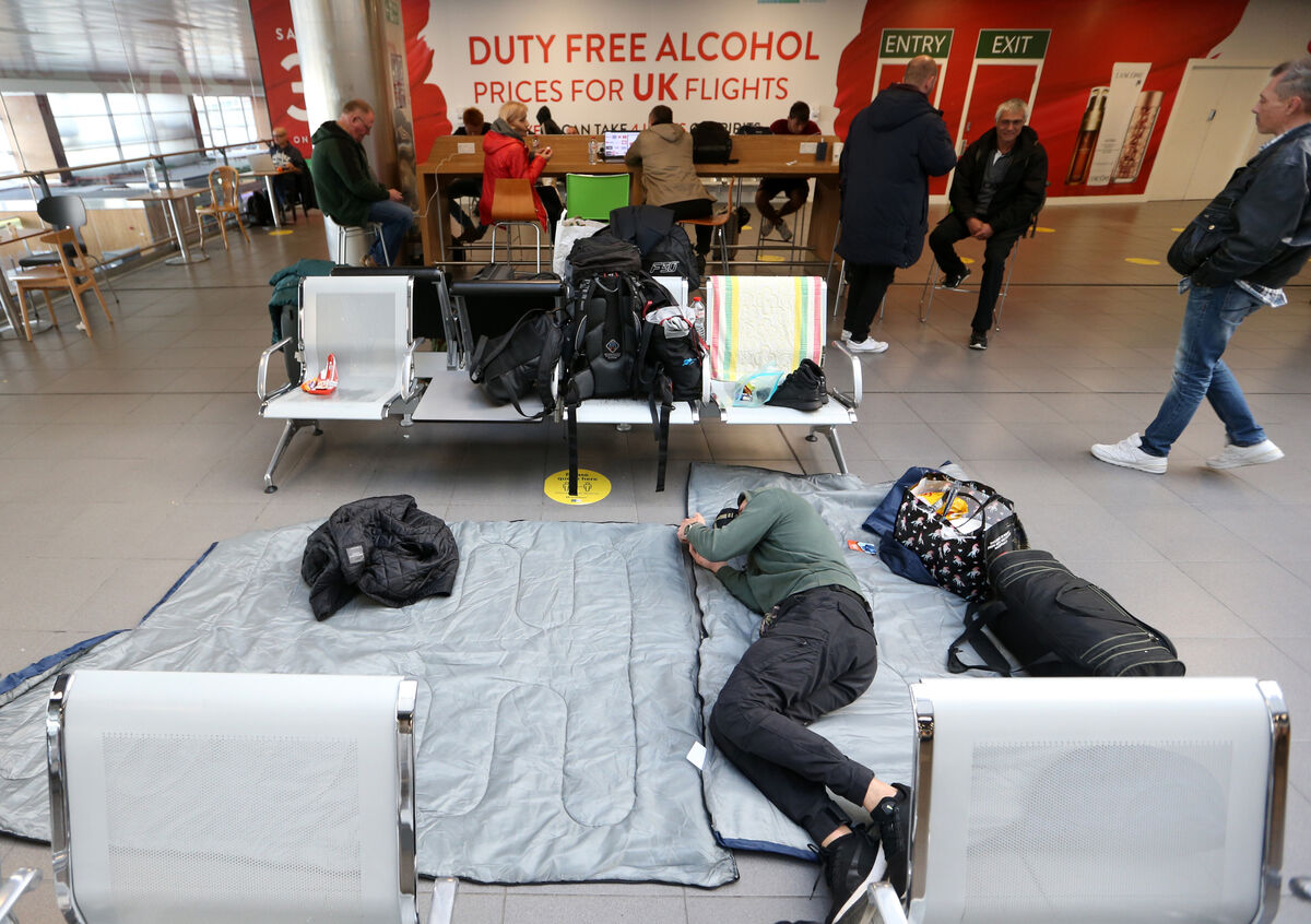 Ukrainian refugee Nikolaj sleeping on the floor at Dublin Airport. Picture: Sasko Lazarov/RollingNews.ie