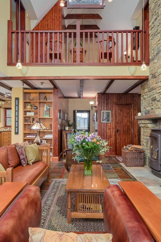 Vaulted ceilings in double height main living area with mezzanine