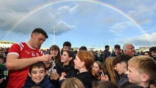 <p>SOMEWHERE OVER...David Clifford signs autographs for young supporters after East Kerry's win.</p>