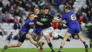 <p>Nemo Rangers's Luke Connolly takes a shot on goal</p>