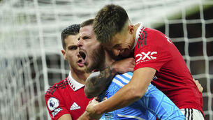 <p>Manchester United's goalkeeper David de Gea, centre, celebrates with his teammates Lisandro Martinez, right, and Diogo Dalot. Picture: AP Photo/Jon Super</p>