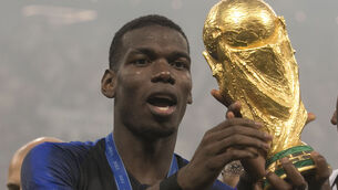 <p>ABSENT: France's Paul Pogba celebrates with the trophy after winning the FIFA World Cup Final at the Luzhniki Stadium four years ago.</p>