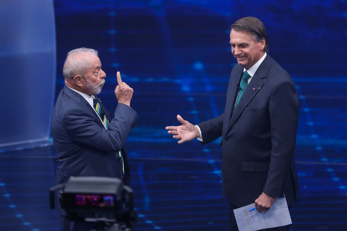 Brazil's former president Luiz Inacio Lula da Silva faces Jair Bolsonaro in a presidential debate at Bandeirantes Television in Sao Paulo, Brazil. Picture: Marcelo Chello/AP
