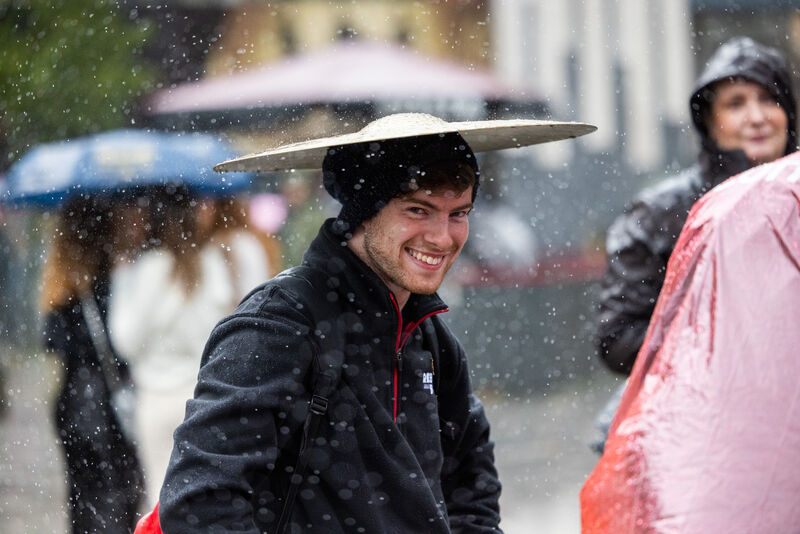 One man dodged the raindrops under a cymbal while watching the New York Brass Band performing at Emmet Place during the Cork Jazz Festival. Picture: Naoise Culhane