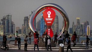 <p>ON SONG:  People gather around the official countdown clock showing remaining time until the kick-off of the World Cup. Picture: AP Photo/Darko Bandic, File</p>