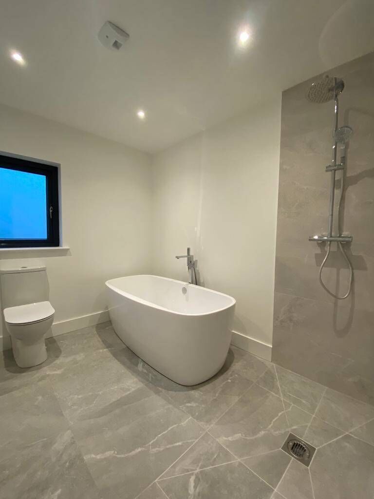 Bathrooms are tiled and fitted with sanitary ware