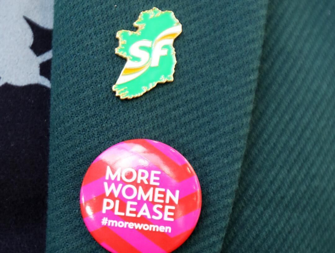 Caroline Kenneally's lapel badges echoed one aspect of the 'time for change' concept during the Sinn Féin ard fheis at the RDS. Photo: Leah Farrell/RollingNews