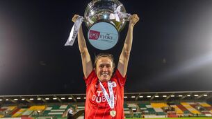 <p>DOUBLE WINNER: Shels’ Heather O'Reilly celebrates with The FAI Women's Cup. Pic: INPHO/Ryan Byrne</p>