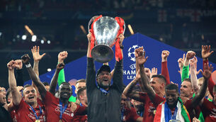 <p>Liverpool manager Jurgen Klopp lifts the trophy with his team after winning the UEFA Champions League Final.</p>