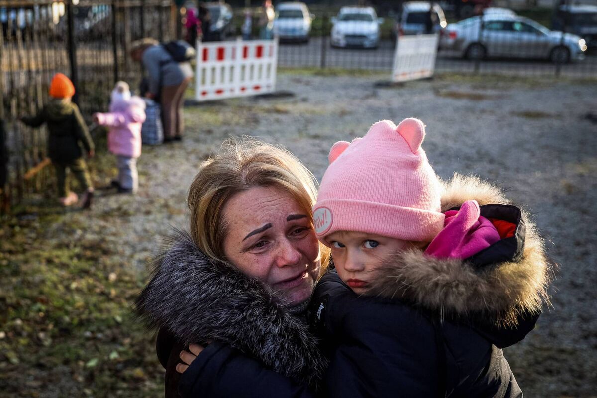 Svetlana Titova, 52, hugs her granddaughter as they arrive from the Russian-held town of Berdyansk, at a humanitarian relief centre in the central Ukrainian city of Zaporizhzhia on November 7. Picture: Anatolii Stepanov