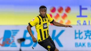 <p>WOLFSBURG, GERMANY - NOVEMBER 08: Youssoufa Moukoko of Borussia Dortmund runs with the ball during the Bundesliga match between VfL Wolfsburg and Borussia Dortmund at Volkswagen Arena on November 08, 2022 in Wolfsburg, Germany. (Photo by Boris Streubel/Getty Images)</p>