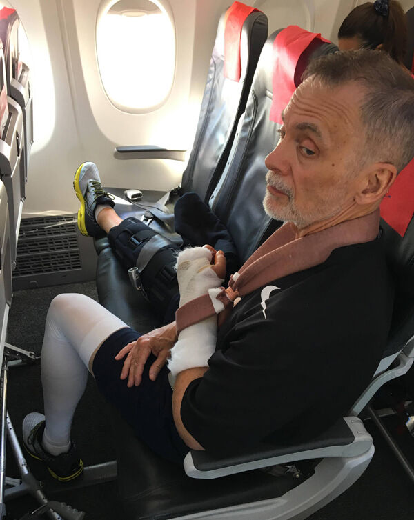 Mr Fryxell on the plane home to the US, where he faces months of physiotherapy and rehabilitation.