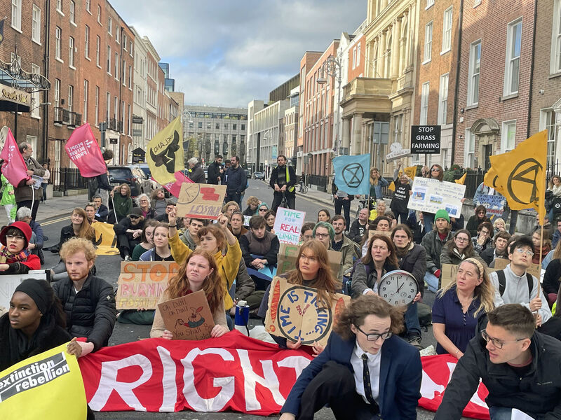 A climate change protest organised by students at Trinity College Dublin is held outside Leinster House in Dublin. Speakers criticised inaction by the Government and the Cop27 UN climate summit being held in Egypt this week. Picture: Grainne Ni Aodha/PA Wire A climate change protest organised by students at Trinity College Dublin is held outside Leinster House in Dublin. Speakers criticised inaction by the Government and the Cop27 UN climate summit being held in Egypt this week. Picture: Grainne Ni Aodha/PA Wire