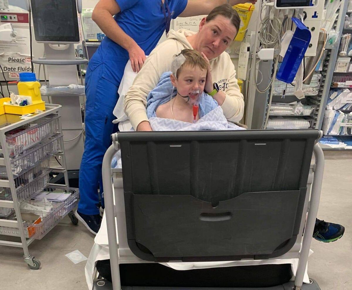 Donnacha with his mum Nicola, who has appealed to others to ensure chargers are not left plugged in when not in use.