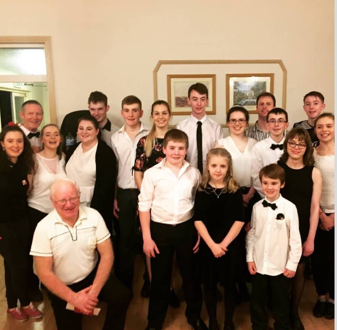 Ted Kelleher with set dancers at the Abbey Hotel, Baile Mhúirne.