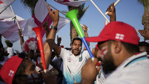 England fans cheer at flag plaza in Doha, Qatar, Friday, Nov. 11, 2022. Final preparations are being made for the soccer World Cup which starts on Nov. 20 when Qatar face Ecuador. (AP Photo/Hassan Ammar)