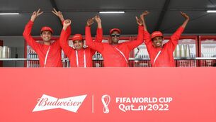 <p>'DRINK WISER. CHEER BETTER': The guys from the Budweiser stand pose for a photo at Fan Festival ahead of the FIFA World Cup in Qatar. Pic: Claudio Villa/Getty Images</p>