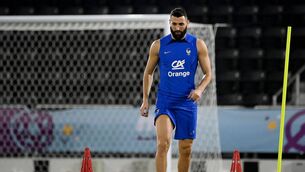 <p>France's forward Karim Benzema takes part in a training session at the Jassim-bin-Hamad Stadium in Doha, ahead of the Qatar 2022 World Cup football tournament. Karim Benzema left a training session injured on November 19, 2022. - France forward Karim Benzema is to undergo medical tests after leaving training injured on November 19, 2022 ahead of the defending champions World Cup opener against Australia. The Real Madrid striker has been struggling with a thigh problem since October and has played less than half an hour of football in his club's last six games. (Photo by FRANCK FIFE / AFP) (Photo by FRANCK FIFE/AFP via Getty Images)</p>