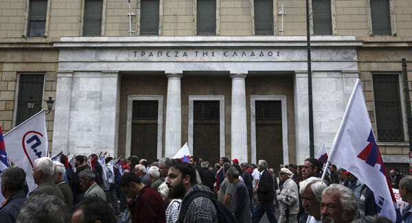Protesters march in front of the Bank of Greece during a 24-hour labour strike in Athens earlier this summer Protesters march in front of the Bank of Greece during a 24-hour labour strike in Athens earlier this summer